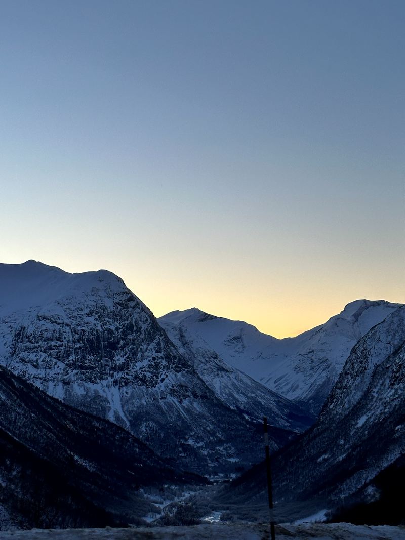 Snowy mountains in the fading evening light